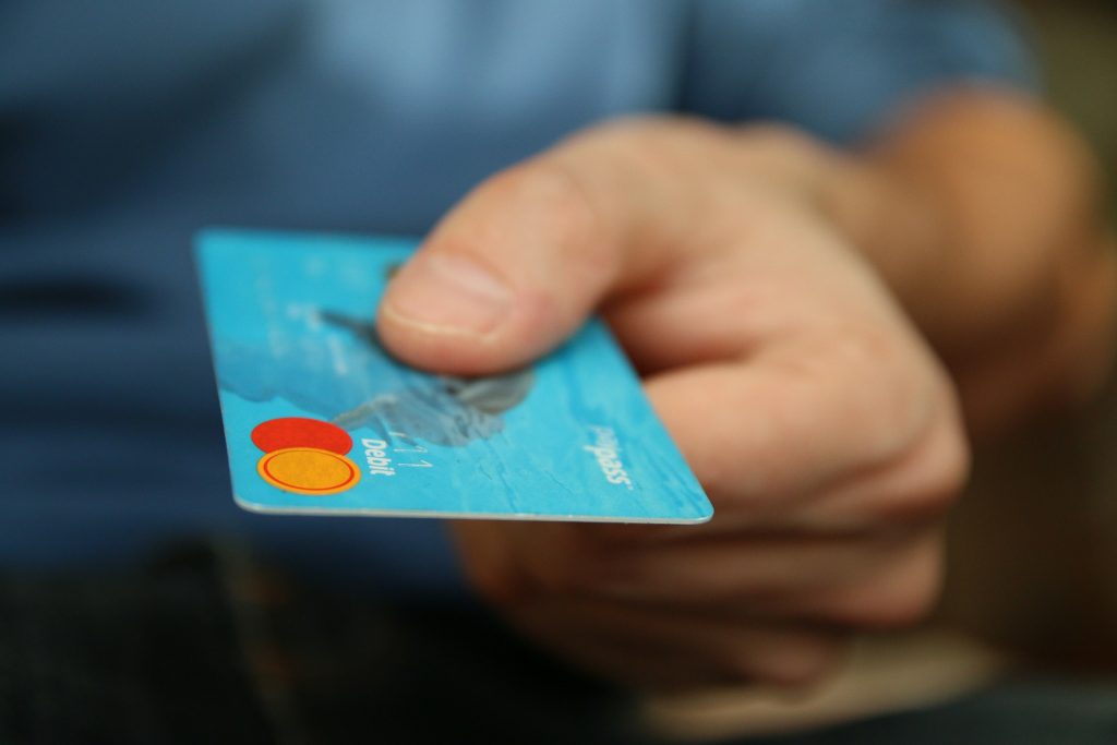Man holding his Credit Card